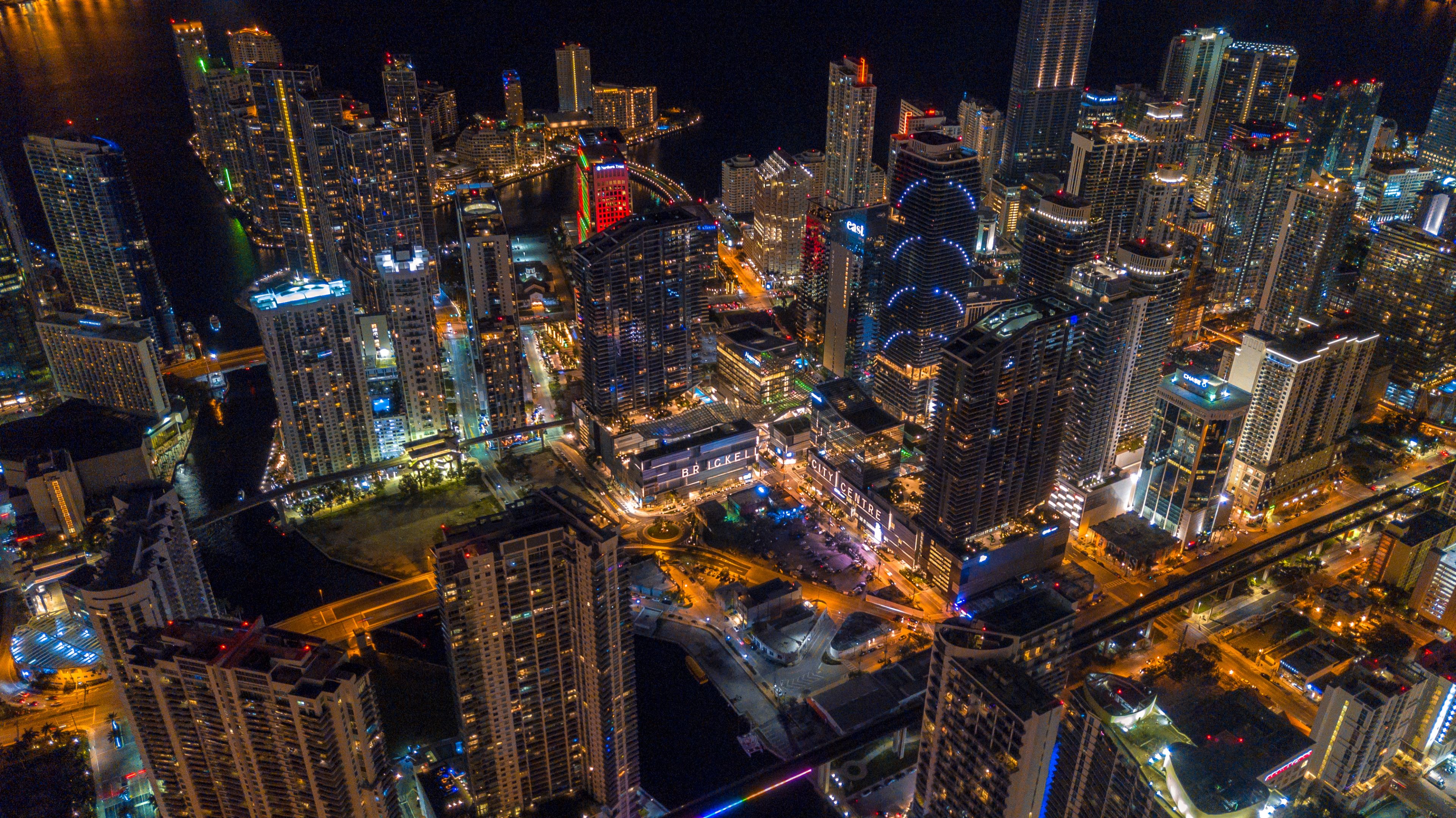 epic drone shot of downtown miami skyline at night